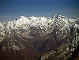 13 Kathmandu Mountain Flight 07-6 Cho Oyu To Gyanchung Kang With Gokyo Valley And Ngozumpa Glacier 1997 A long ice ridge connects Nangpai Gosum I (7351m) to Cho Oyu (8201m) to the little known Gyachung Kang (7952m), the 15th highest mountain in the world. The Gokyo Valley snakes up to the Ngozumpa Glacier, the largest in Nepal. This image is from my first Kathmandu Mountain flight in 1997.
